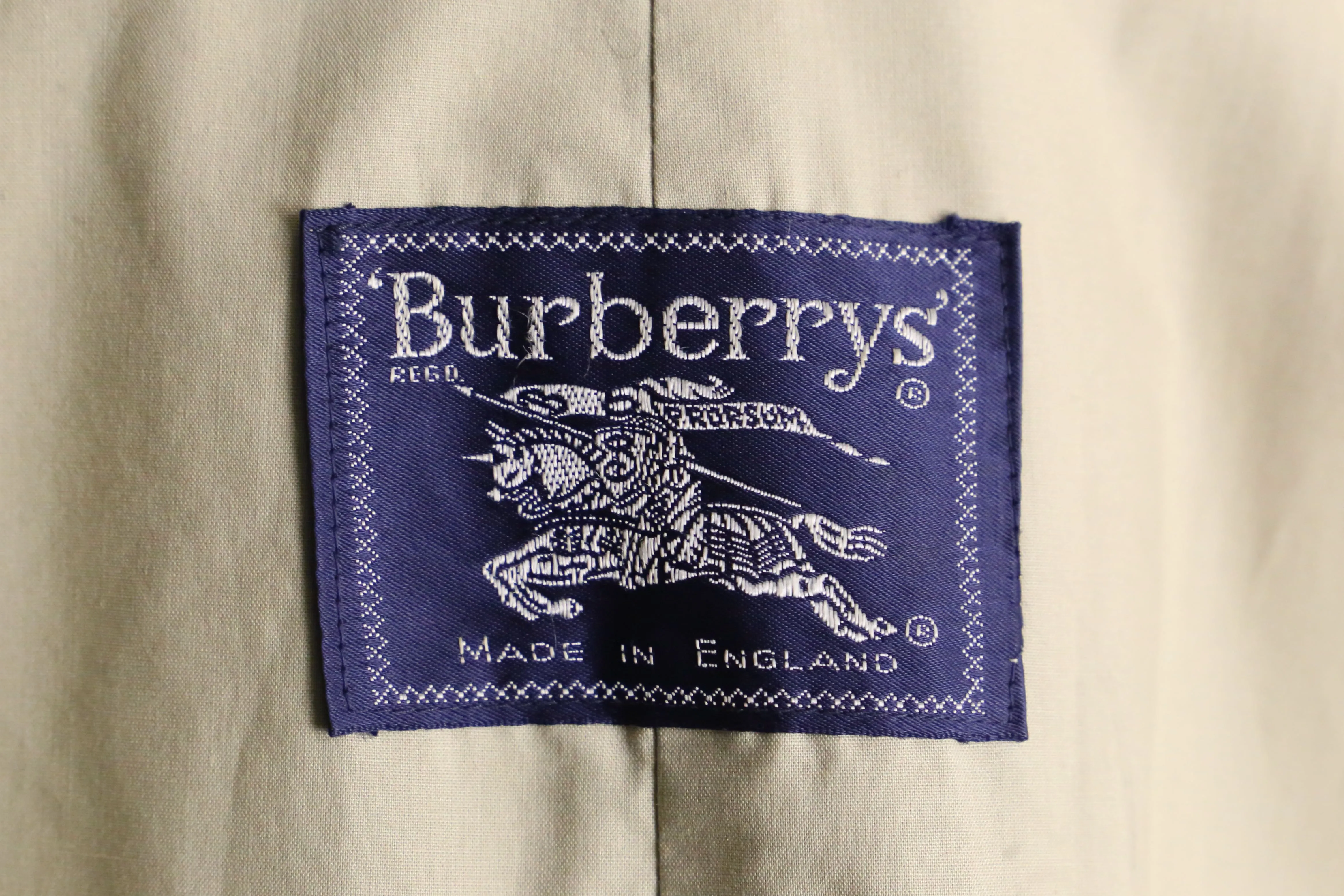 "Burberry's" natural beige long trench coat